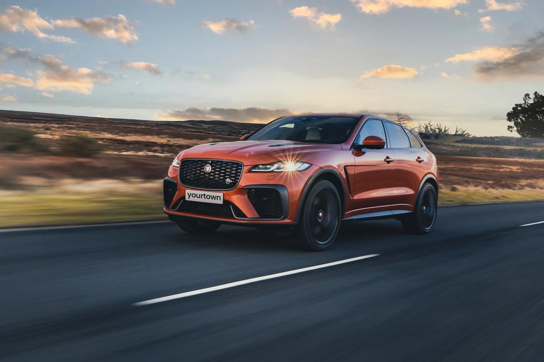 Orange Jaguar F-Pace front view, left hand drive model is shown.