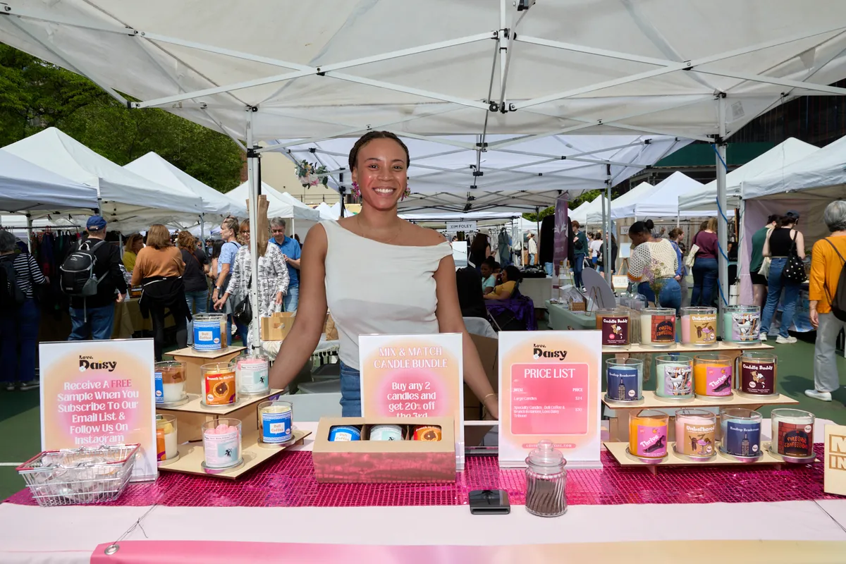 Setting up at a pop-up market - Love Daisy booth.webp