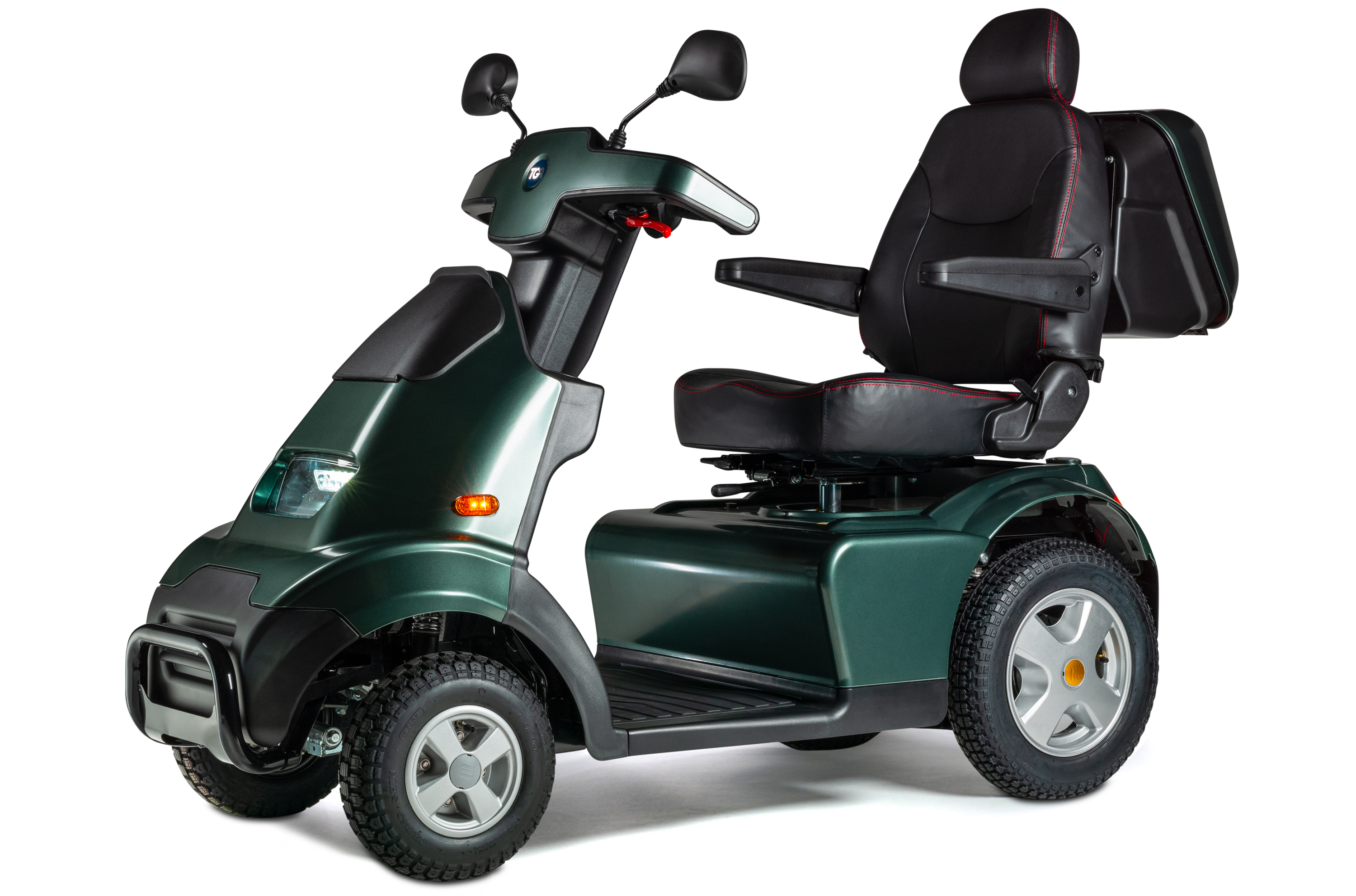 The Breeze X Range mobility scooter, shown against a plain white background, features a robust three-wheel design with large, treaded tires. It has a spacious padded seat with a headrest and armrests, ergonomic handlebars with dual mirrors, and a rear storage compartment. The scooter is styled in a dark green finish, combining comfort, safety, and durability for outdoor use.