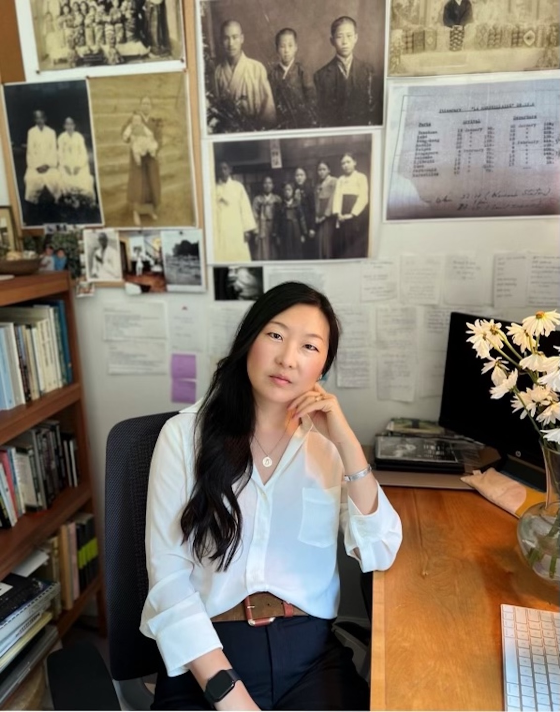 Christina Moon Associate Professor of Fashion Studies sitting in an office at a desk.