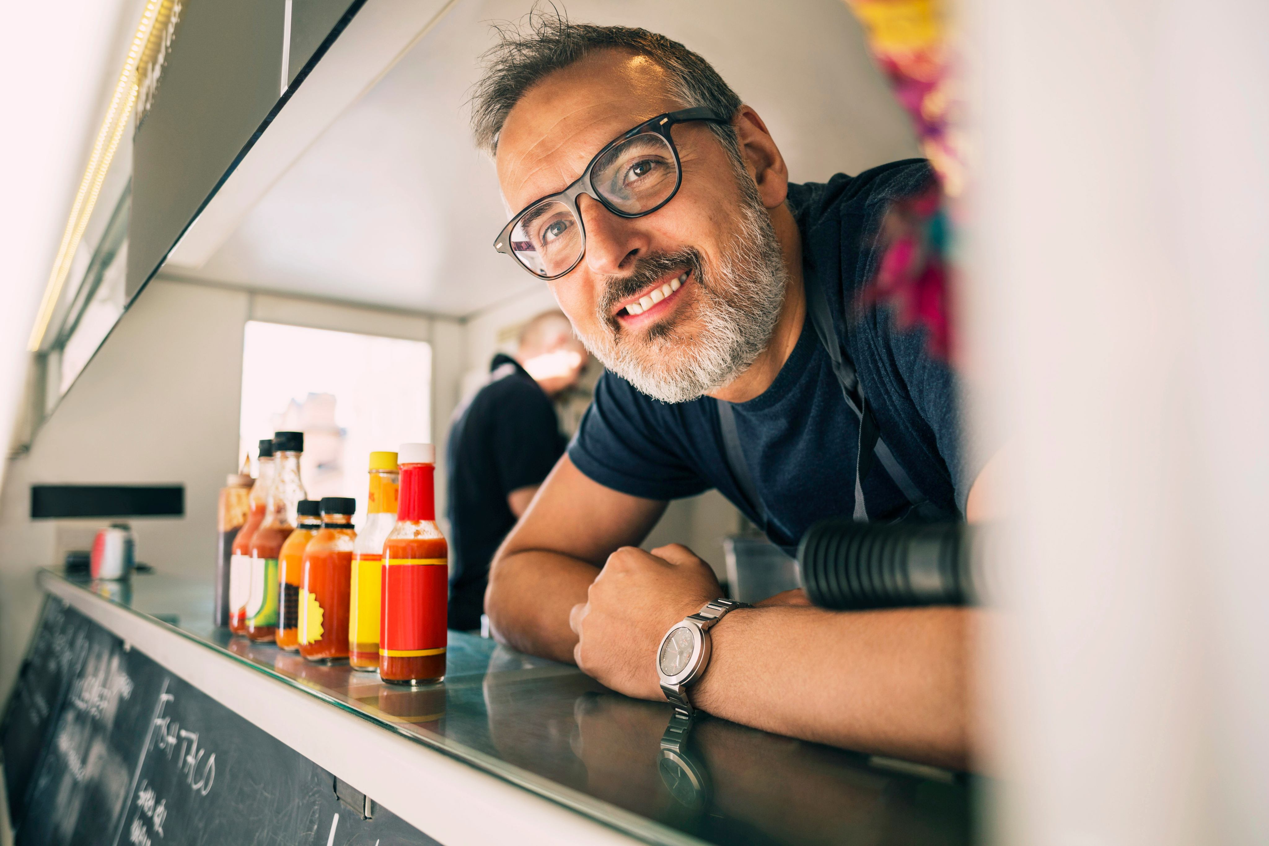 food truck owner in window