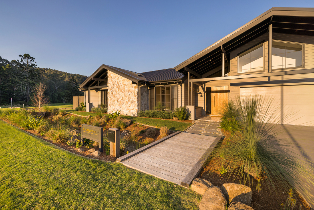 yourtown Prize Home Christmas Draw 542 is a large single level home with stone feature wall at the front, garden and driveway leading to the garage.