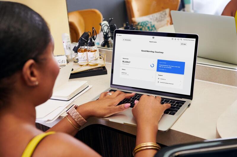 Business owner checking her Square Dashboard
