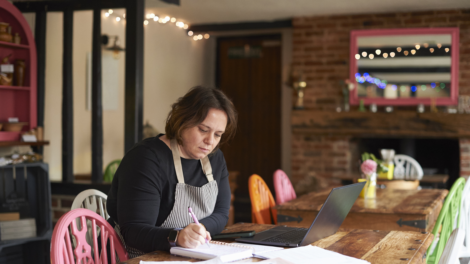 Cafe owner doing her paperwork
