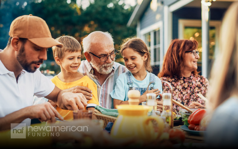 A happy multi-generational family enjoys a meal together