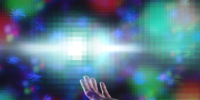 A woman's hands immersed in the world of the Metaverse.