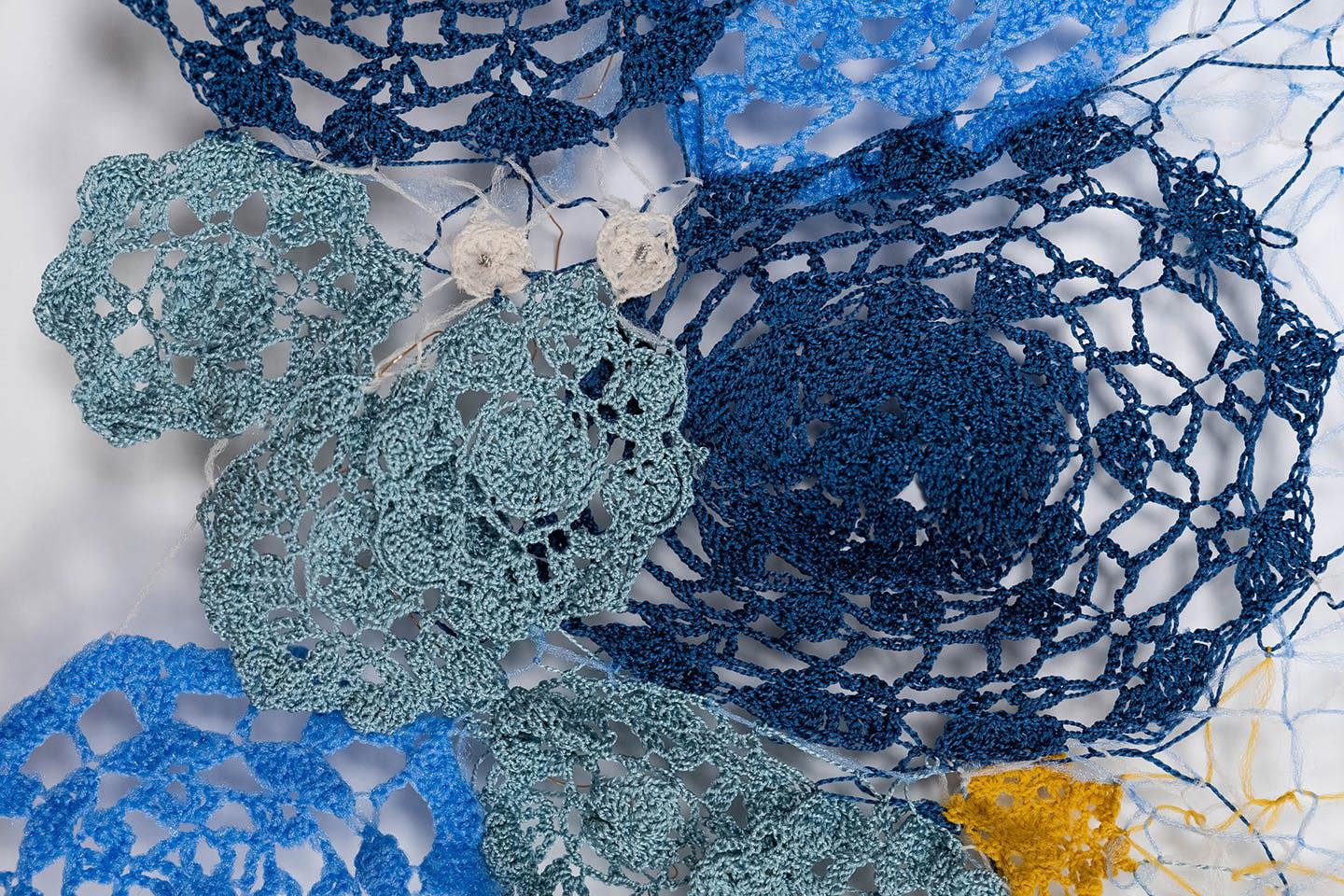 Detail view of Moie Qian Yang’s crocheted project, featuring a design inspired by traditional Turkish tile motifs.