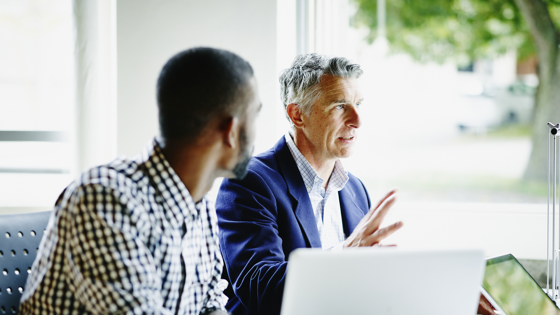 Businessman leading discussion with coworkers