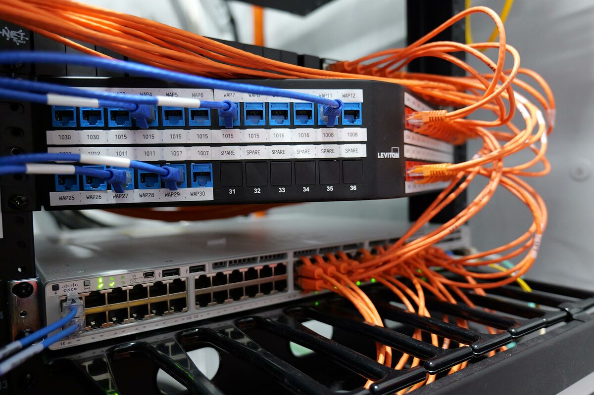 BICSI structured cabling installation featuring Leviton patch panel and Cisco network switch connections
