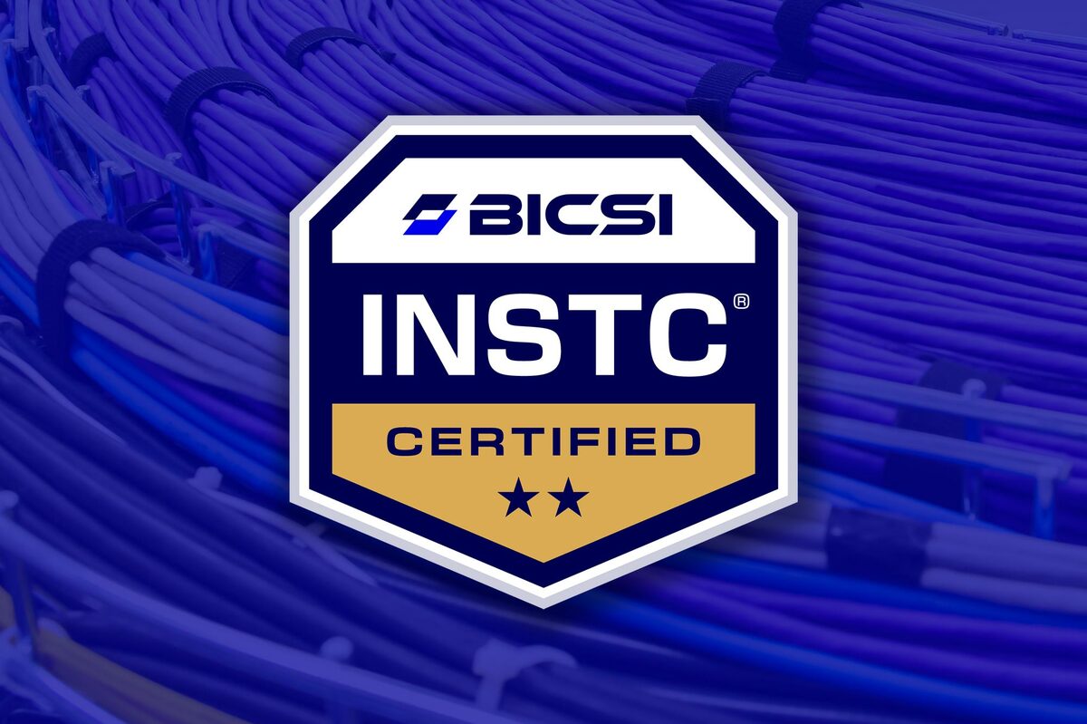 BICSI INSTC credential badge over blue cable background overlay