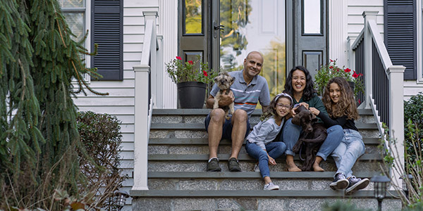 family sitting on the front stairs