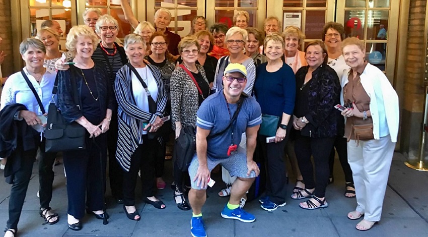 A group photo in front of a theater in New York City