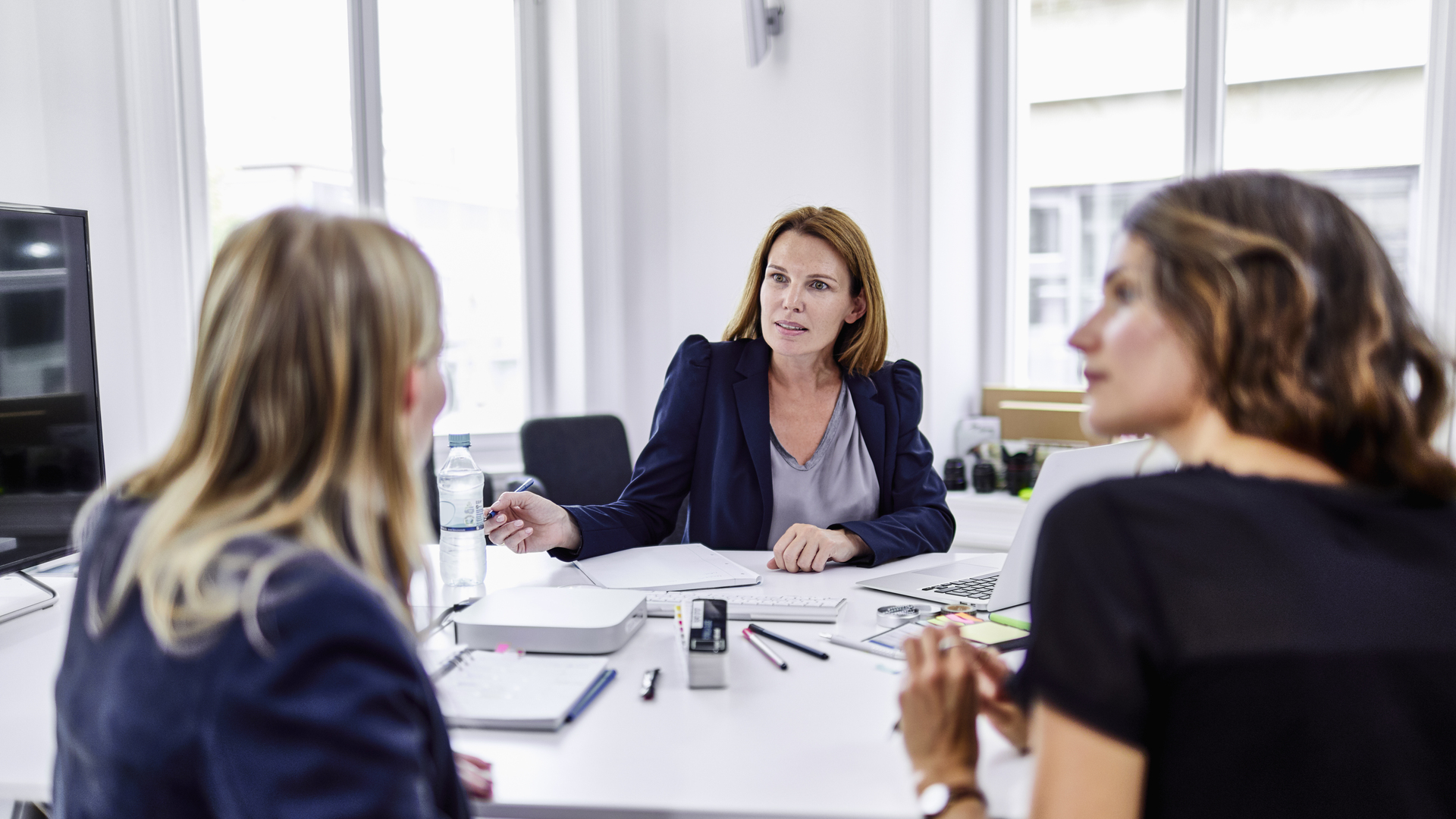 Three businesswomen having a meeting in office