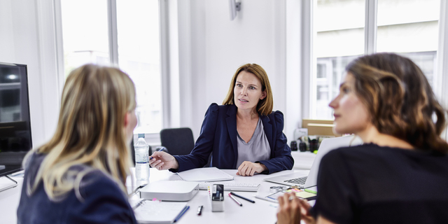 Three businesswomen having a meeting in office