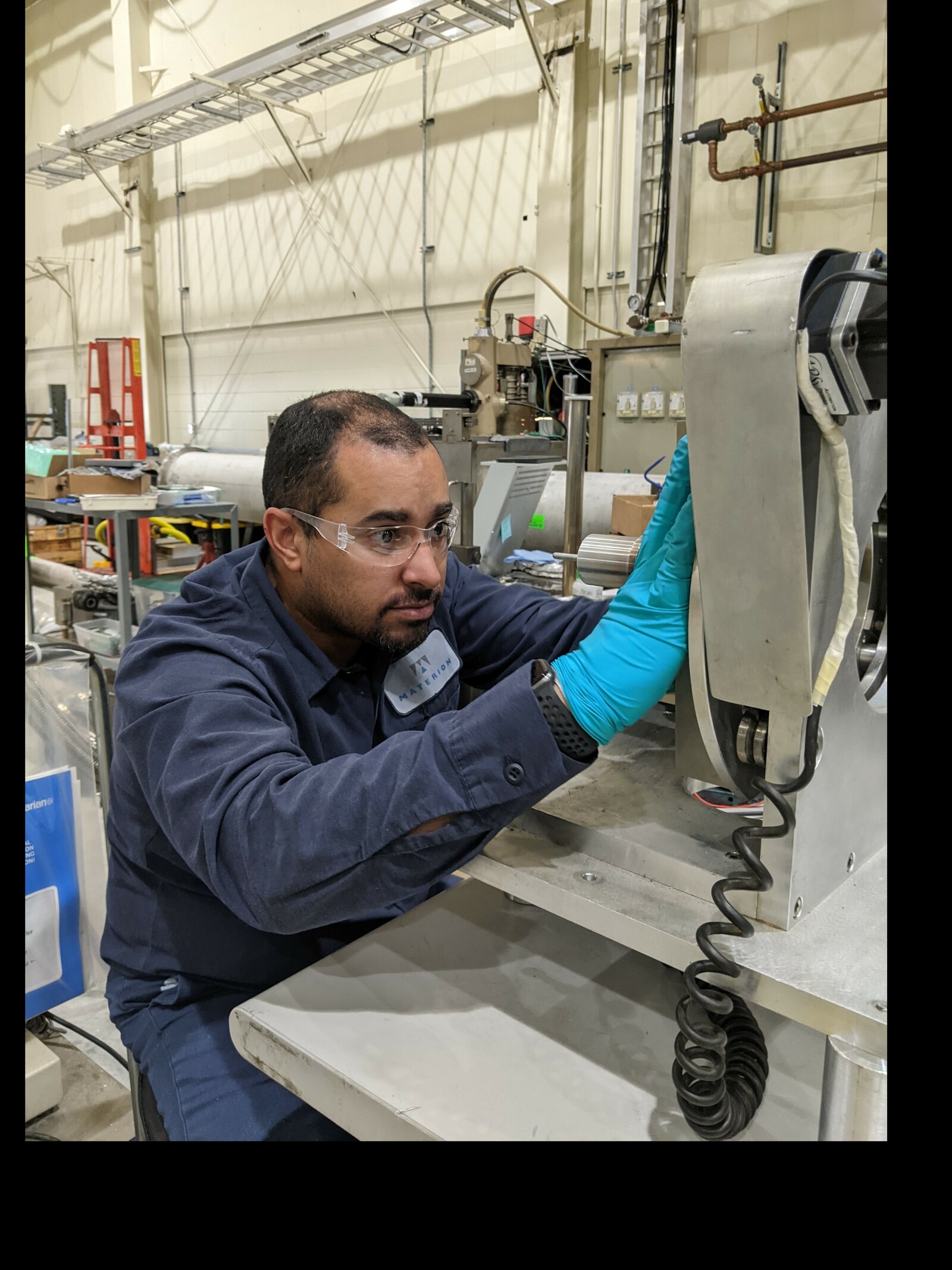 Materion employee working on beryllium part