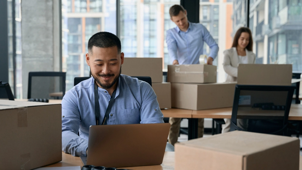 Stock image of office worker looking at laptop