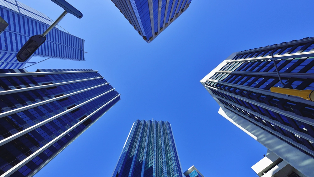 Stock image of Office buildings looking up