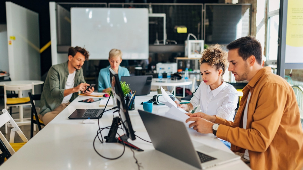 Stock image of workers in meeting room