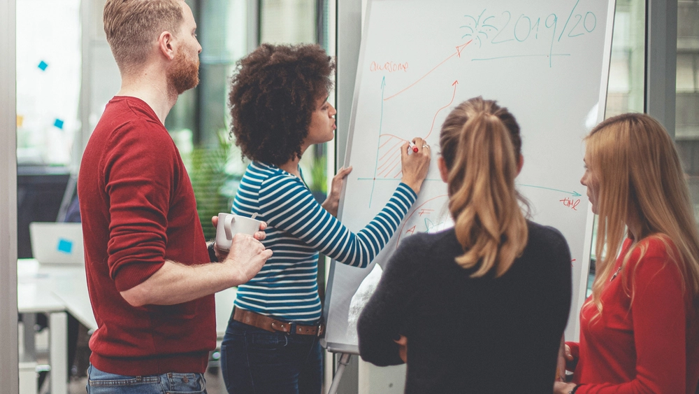 Stock image of workers in meeting room