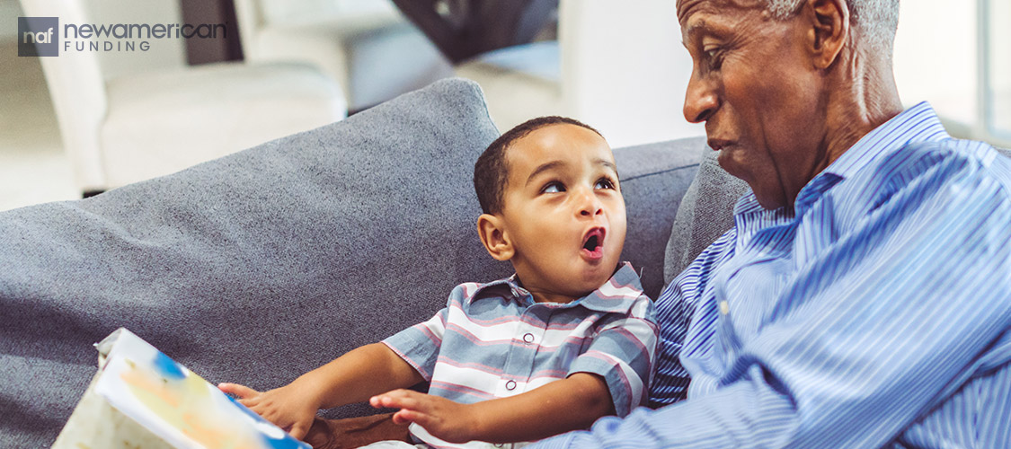 grandfather reading to adorable grandson