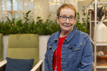 Peer visitors Susan Brill, who has volunteered for three years, is a familiar face at the Magnolia Library and Coffee Connections.