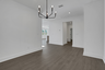 dining room with hard surface flooring and matte black light fixture