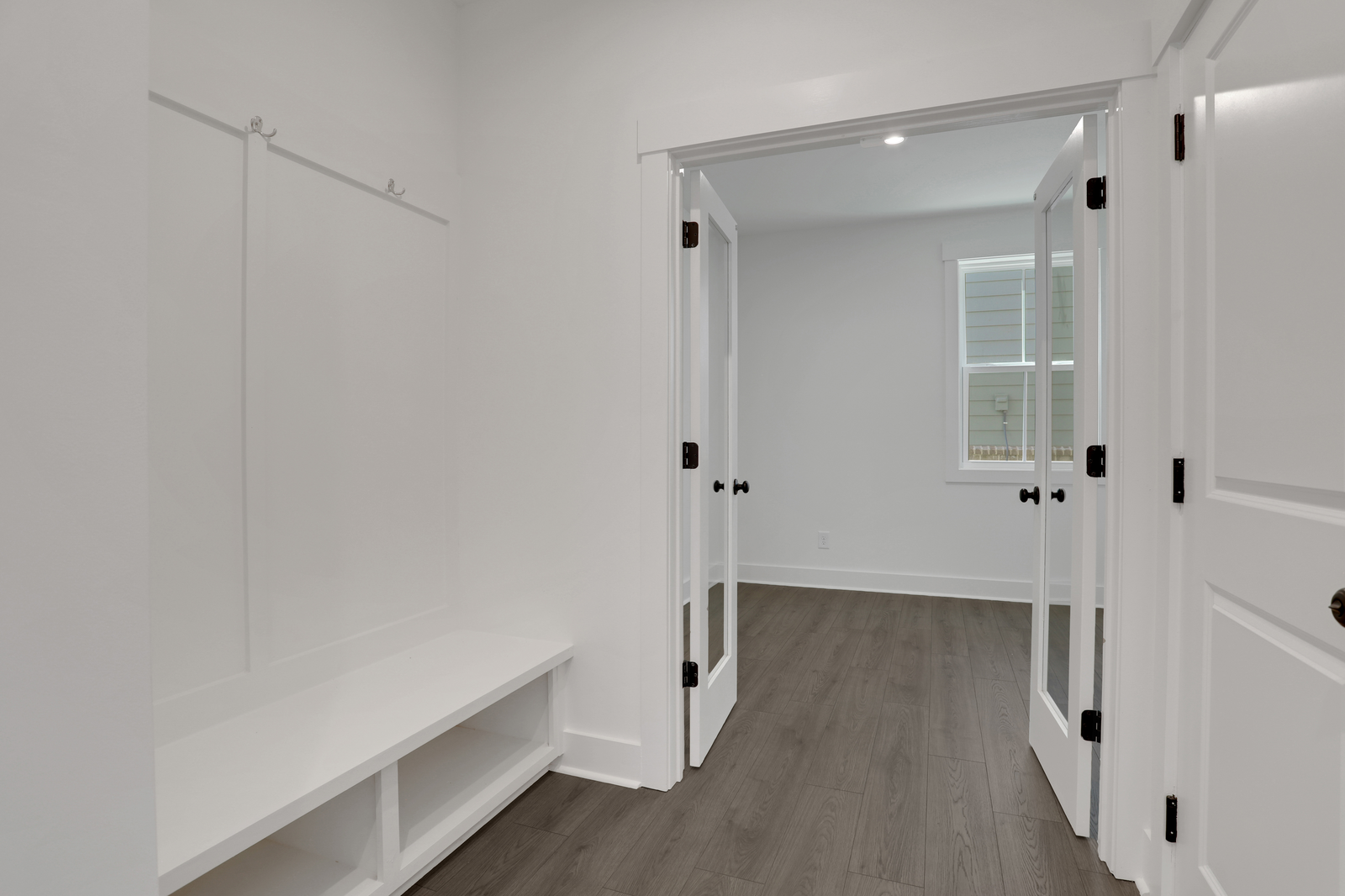 mudroom with valet leading to office