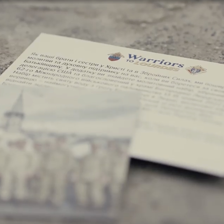 Prayer cards for Warriors to Lourdes Pilgrimage marked in the Ukrainian language.