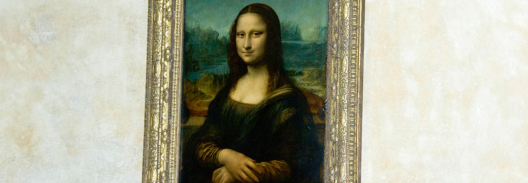The Mona Lisa painting hangs in an ornate gold frame during an exhibition in North Carolina.