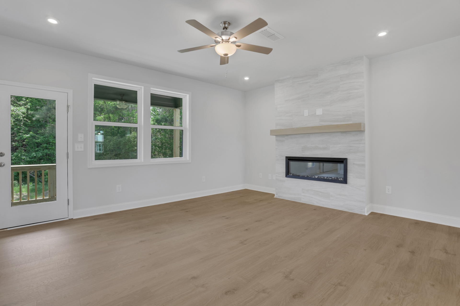 great room with electric fireplace and hard surface flooring
