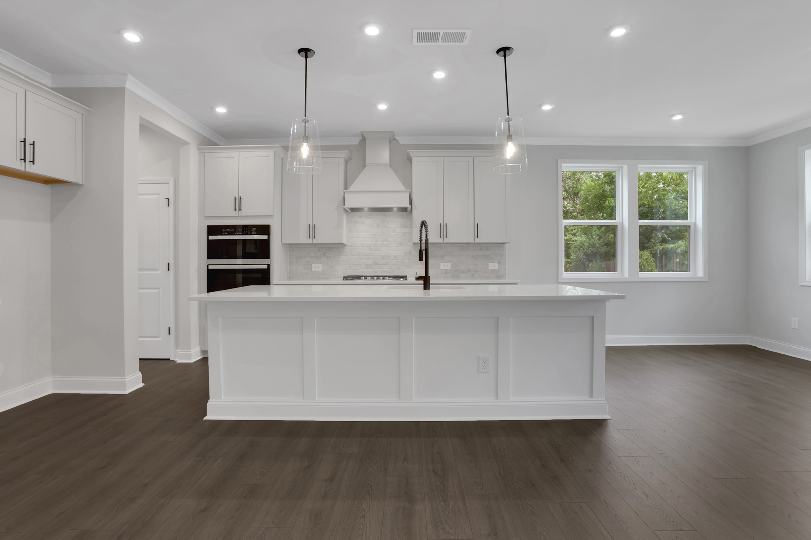 kitchen with white cabinets and quartz counters
