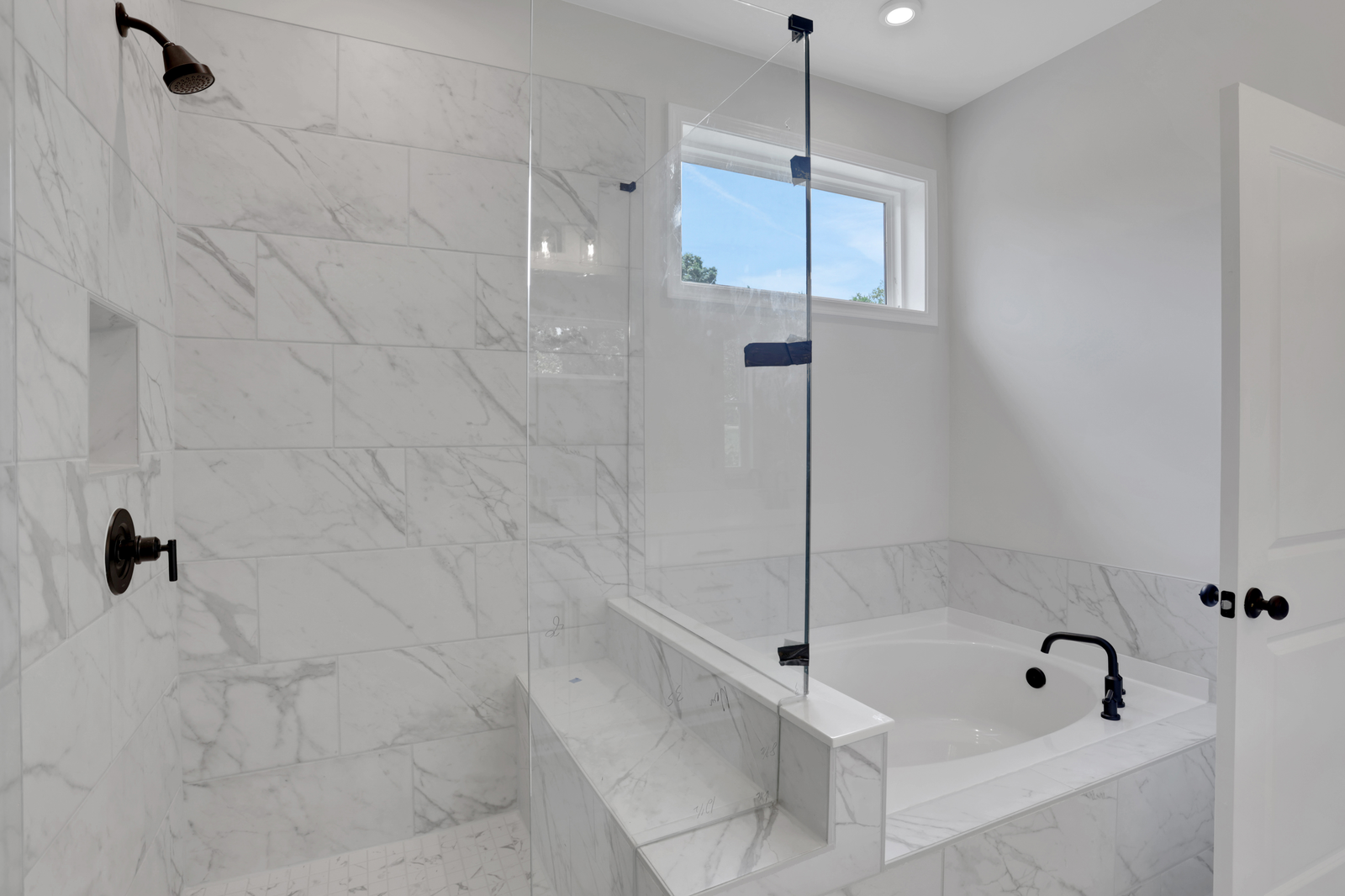 primary bathroom with separate shower and tub