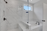 primary bathroom with separate shower and tub