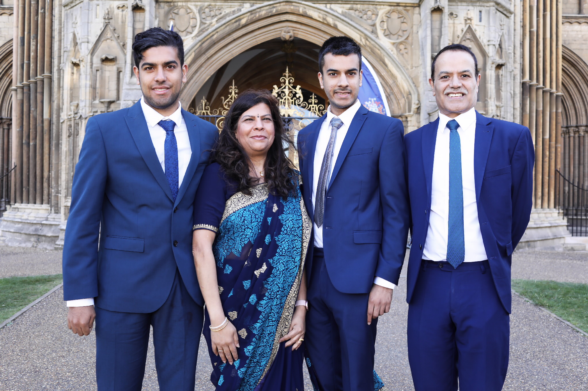 A family group posing in front of the cathedral entrance