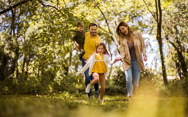 A family walking in the grass