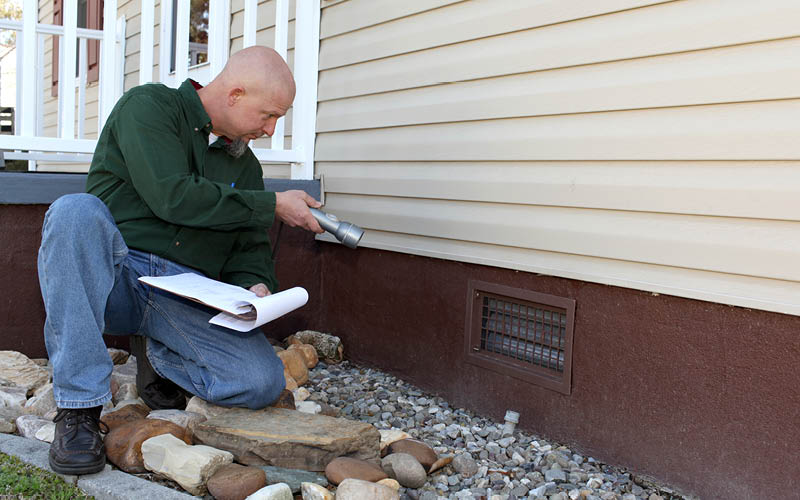 A person inspecting a home