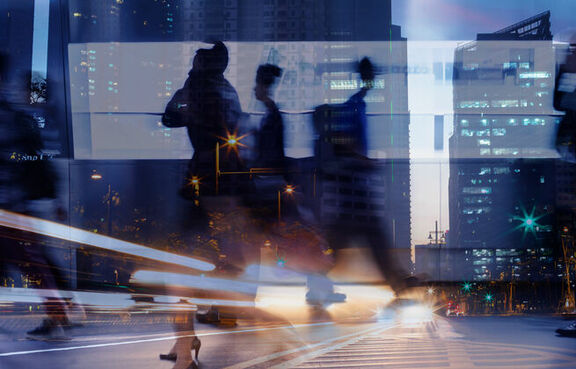 Overexposure photo of people walking on a street
