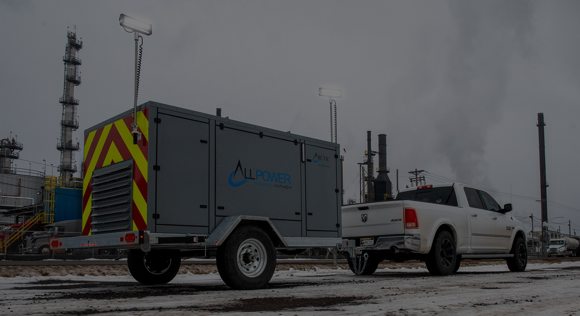 Fathom All Power trailer and truck in front of industrial site in winter