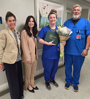 Amanda Wingrove, a nurse on 3 North at Moffitt Magnolia campus, celebrates receiving a 2026 midyear DAISY Award with Moffitt leaders.