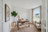 study with wood flooring, accent wall, desk and chair, windows, and curtains