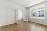 study with large windows and white french doors
