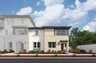 exterior of two-story townhome with large windows and neutral paint