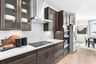 white quartz countertops with black hardware & brown cabinets