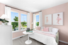 bedroom with twin bed, bedside table, and dresser