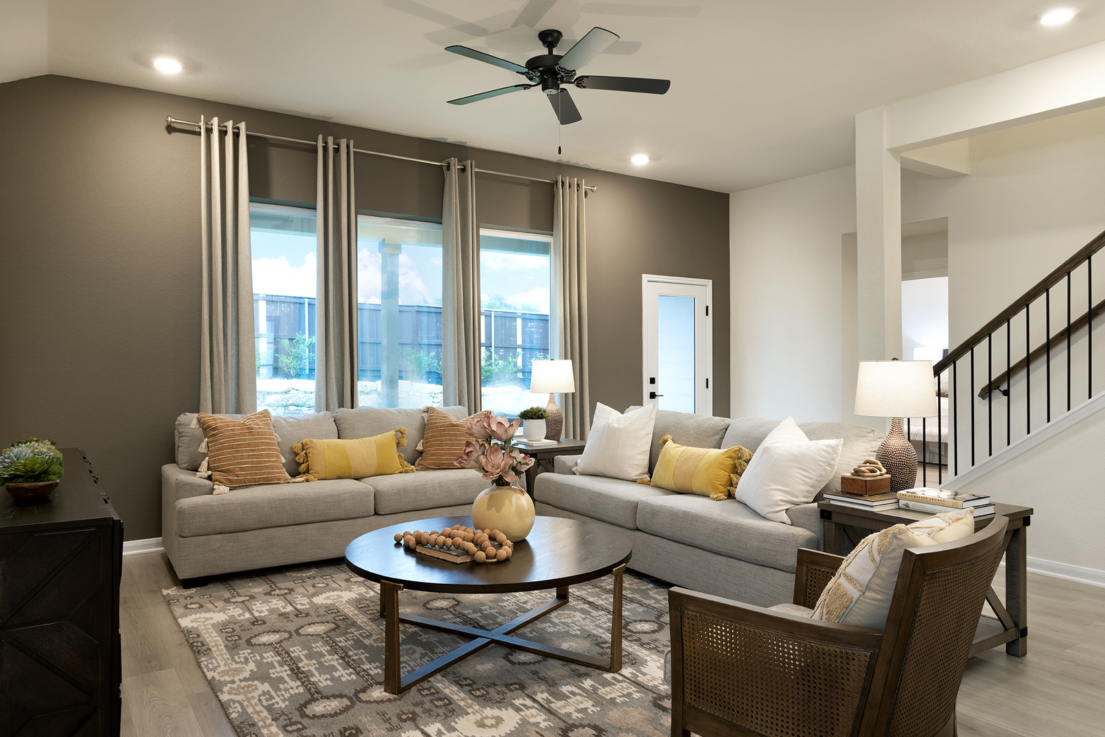 great room with couches & large windows