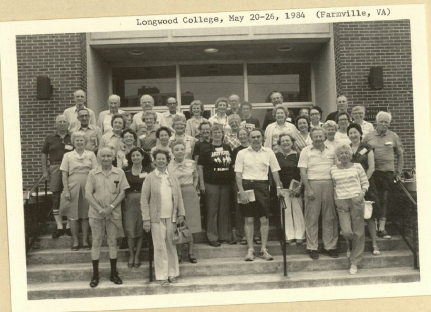 Road Scholars stand on the steps of a building at Longwood College in a black and white photo