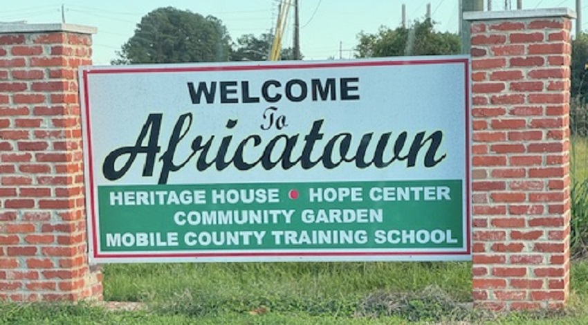 A sign welcomes visitors to Africatown