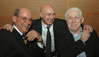 President and CEO Jim Moses put his arms around Founders Marty Knowlton and David Bianco