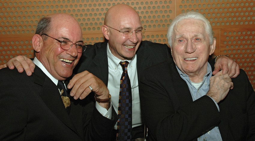 President and CEO Jim Moses put his arms around Founders Marty Knowlton and David Bianco