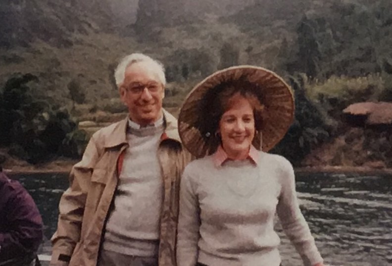 Karen's parents in front of a river in Vietnam